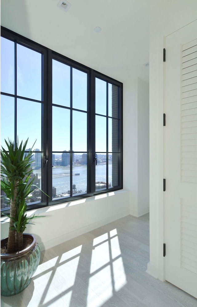 959 1st Ave Unit 25E, New York City, NY 10022 - empty room with wood finished floors and a water view