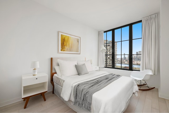 959 1st Ave Unit 25E, New York City, NY 10022 - bedroom featuring wood finished floors
