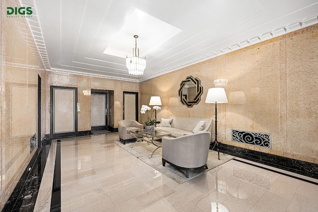 living area with a chandelier and a skylight