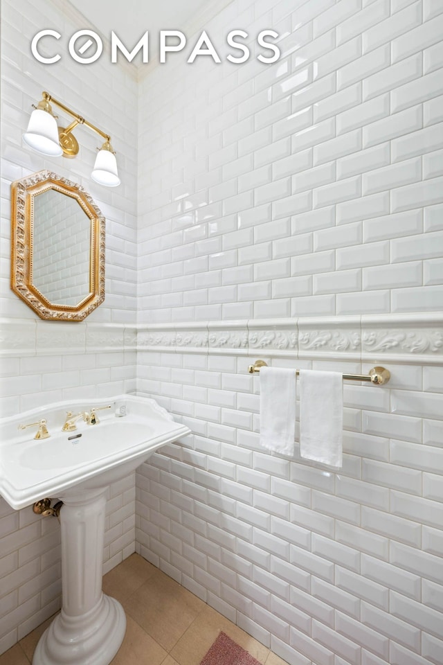 bathroom featuring tile patterned flooring and tile walls