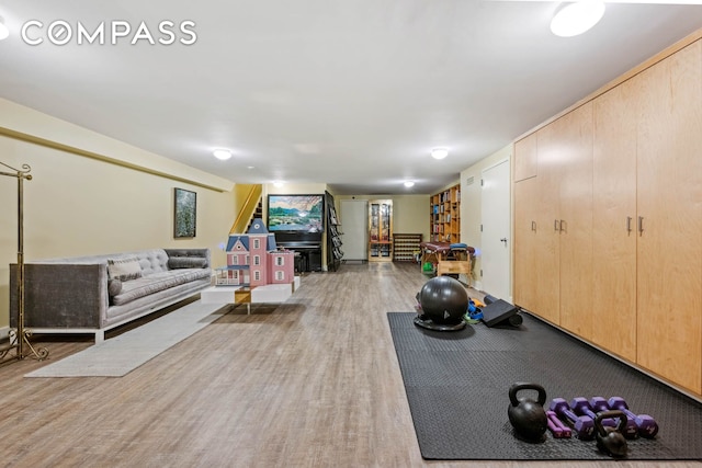 exercise area with wood finished floors