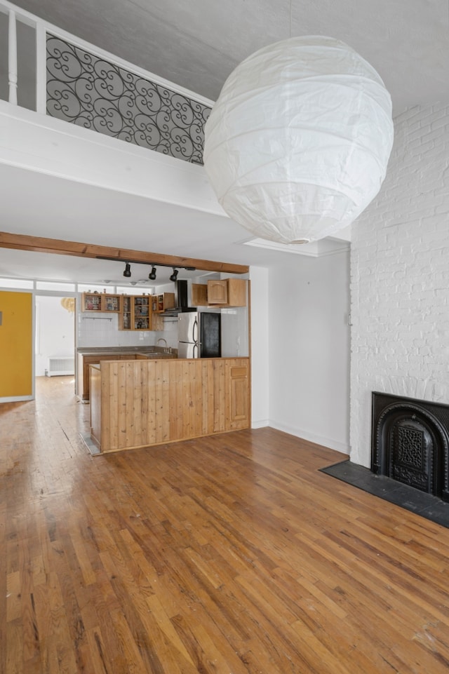 424 Atlantic Avenue Multifam, New York City, NY 11217 - unfurnished living room featuring wood-type flooring, a large fireplace, and baseboards