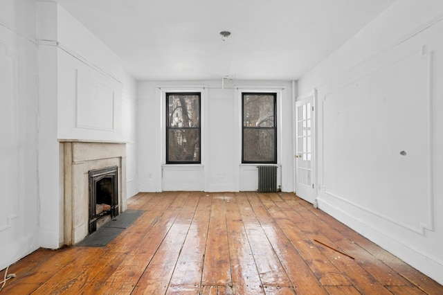 424 Atlantic Avenue Multifam, New York City, NY 11217 - unfurnished living room featuring hardwood / wood-style flooring and a fireplace with flush hearth