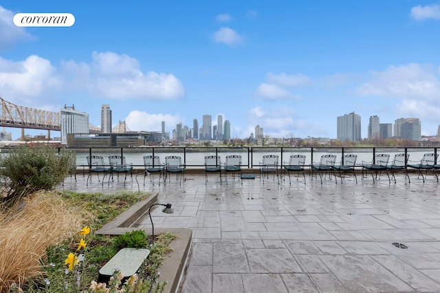 25 Sutton Pl S Unit 16O, New York City, NY 10022 - view of patio / terrace featuring a view of skyline, a water view, and a dock