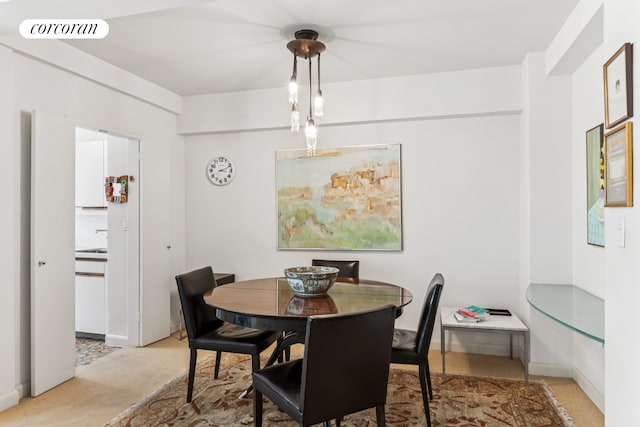 25 Sutton Pl S Unit 16O, New York City, NY 10022 - dining space with light carpet and baseboards