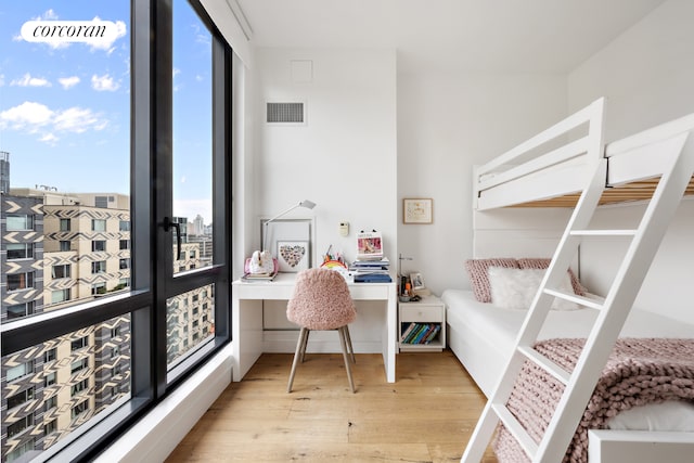 23 W 116th St Unit 12D, New York City, NY 10026 - bedroom with wood finished floors