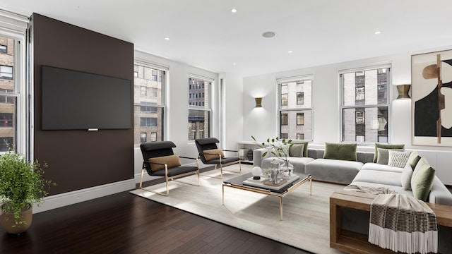 living room with wood-type flooring and recessed lighting