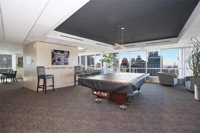rec room with carpet, billiards table, and floor to ceiling windows