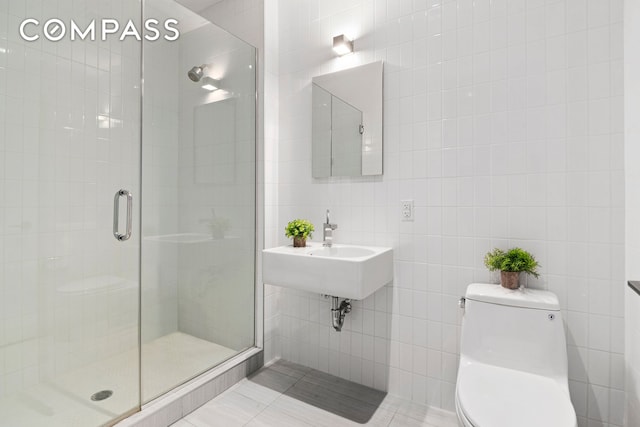 360 Furman St Unit 320/321, New York City, NY 11201 - bathroom with toilet, tile walls, a stall shower, and a sink