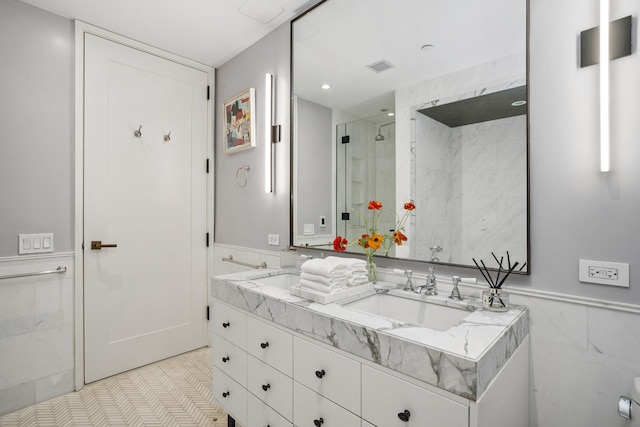 438 E 12th St Phd, Phd, New York City, NY 10009 - full bathroom with a sink, double vanity, a wainscoted wall, visible vents, and a stall shower