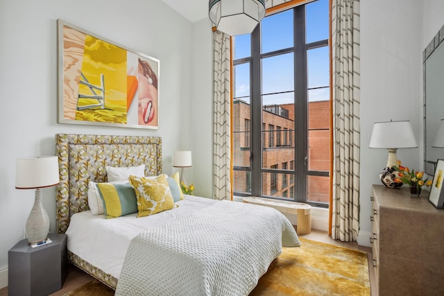 438 E 12th St Phd, Phd, New York City, NY 10009 - bedroom featuring baseboards and multiple windows