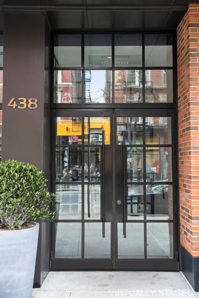 438 E 12th St Phd, Phd, New York City, NY 10009 - view of exterior entry featuring brick siding