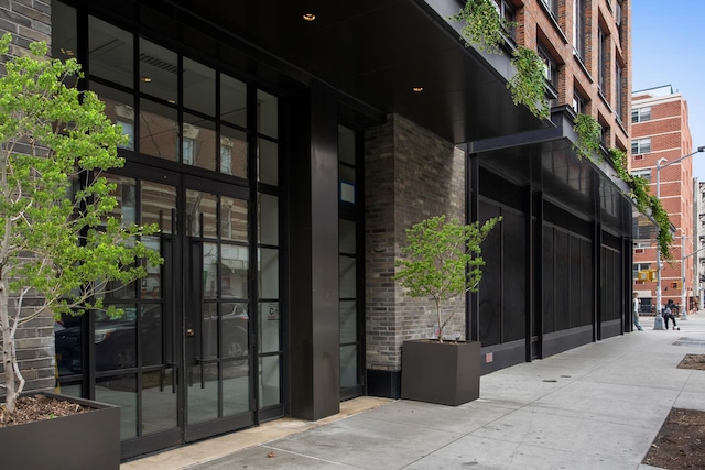 438 E 12th St Phd, Phd, New York City, NY 10009 - entrance to property with french doors and brick siding