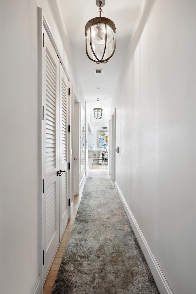 438 E 12th St Phd, Phd, New York City, NY 10009 - hall featuring visible vents and a chandelier
