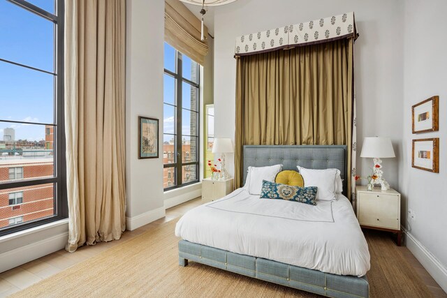 438 E 12th St Phd, Phd, New York City, NY 10009 - bedroom featuring baseboards and multiple windows