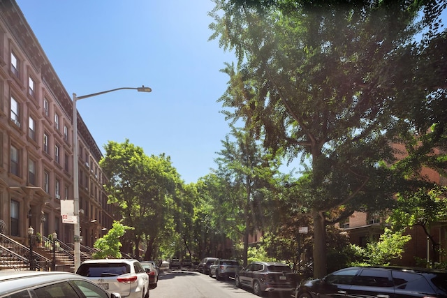 57 W 130th St Pha, Pha, New York City, NY 10037 - view of asphalt road with street lights and stairway