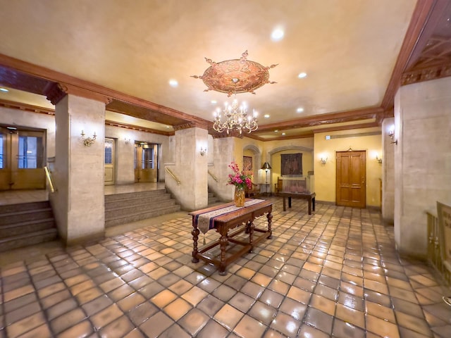 building lobby with ornamental molding, stairs, and recessed lighting