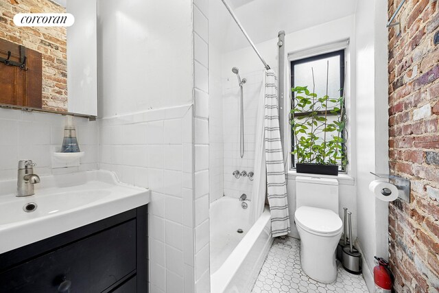 551 W 160th St Unit 5B, New York City, NY 10032 - bathroom with toilet, shower / tub combo, vanity, and brick wall
