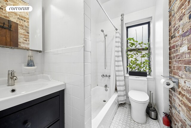 551 W 160th St Unit 5B, New York City, NY 10032 - full bath with shower / bath combination with curtain, toilet, vanity, and brick wall