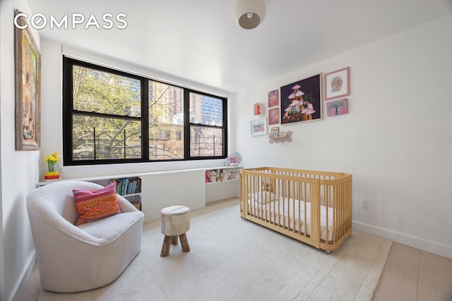 bedroom with multiple windows and baseboards