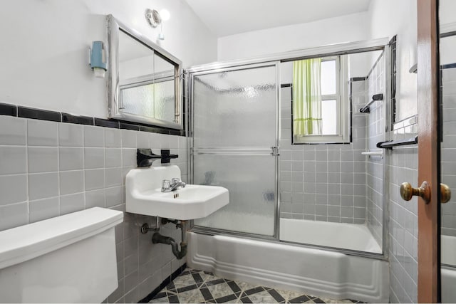 1010 Sherman Ave Unit 5L, New York City, NY 10456 - full bath with toilet, shower / bath combination with glass door, and tile walls