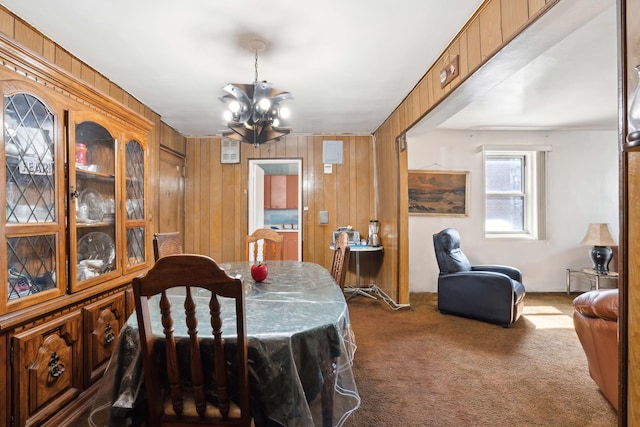 1010 Sherman Ave Unit 5L, New York City, NY 10456 - carpeted dining room featuring a chandelier and wooden walls