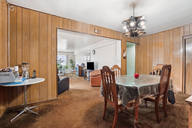 1010 Sherman Ave Unit 5L, New York City, NY 10456 - dining area featuring dark carpet, wooden walls, and a chandelier