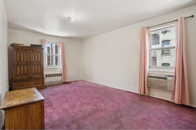 1010 Sherman Ave Unit 5L, New York City, NY 10456 - empty room with radiator, dark carpet, and cooling unit