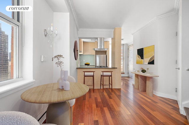 206 E 95th St Unit 16A, New York City, NY 10128 - dining space with hardwood / wood-style flooring, ornamental molding, and baseboards