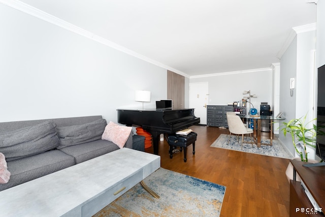 living room with crown molding, wood finished floors, and a desk