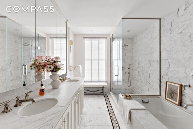 400 W 12th St Unit Th3, New York City, NY 10014 - full bath featuring double vanity, a garden tub, marble tiled floors, and a marble finish shower