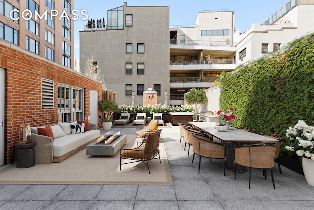 400 W 12th St Unit Th3, New York City, NY 10014 - view of patio with an outdoor living space with a fire pit and outdoor dining space