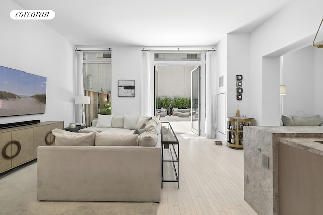 91 Leonard St Unit 2E, New York City, NY 10013 - living room featuring light wood finished floors