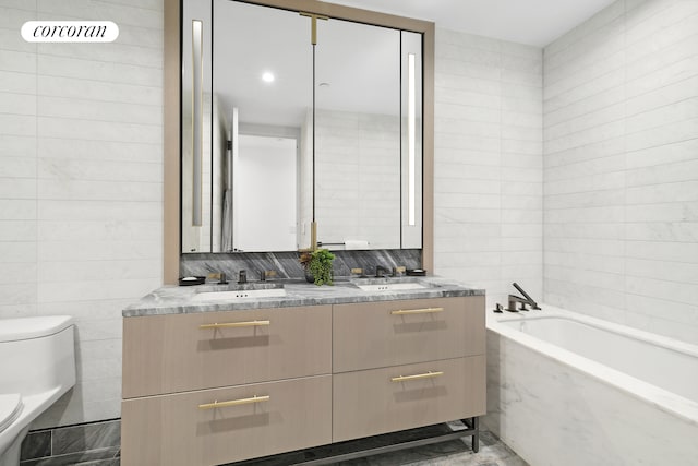91 Leonard St Unit 2E, New York City, NY 10013 - bathroom featuring toilet, double vanity, a garden tub, and tile walls