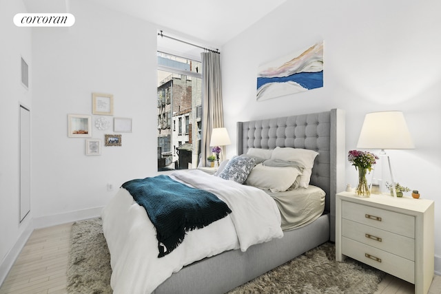 91 Leonard St Unit 2E, New York City, NY 10013 - bedroom featuring wood finished floors and baseboards