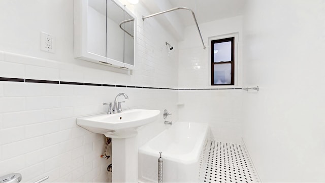 bathroom with tile walls