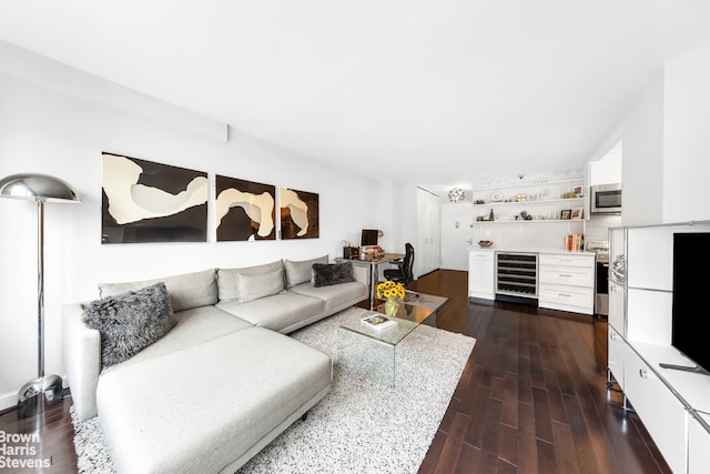 200 E 27th St Unit 6J, New York City, NY 10016 - living area featuring beverage cooler, dark wood-style flooring, and a bar