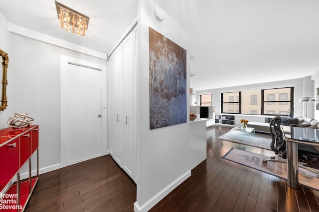200 E 27th St Unit 6J, New York City, NY 10016 - entrance foyer with wood-type flooring, a chandelier, and baseboards