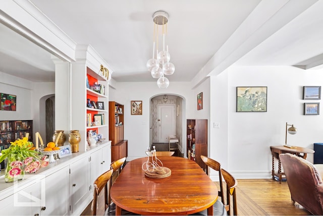 414 E 52nd St Unit 2A, New York City, NY 10022 - dining space with arched walkways and wood finished floors