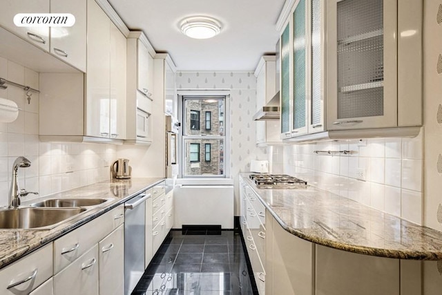 650 Park Ave Unit 11B/12B, New York City, NY 10065 - kitchen featuring a sink, appliances with stainless steel finishes, backsplash, and glass insert cabinets