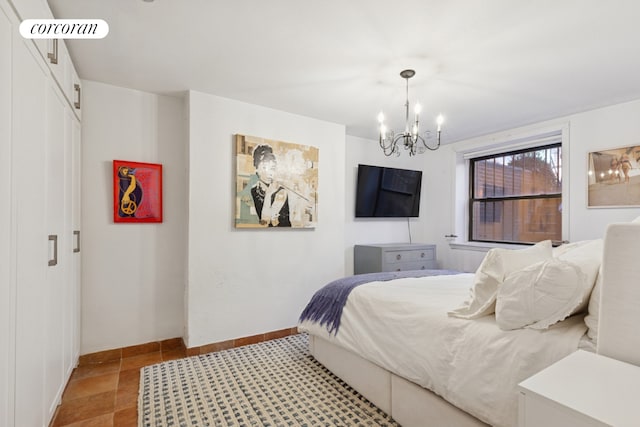 450 W 20th St Garden, Unit Garden, New York City, NY 10011 - bedroom featuring a chandelier, baseboards, and a closet
