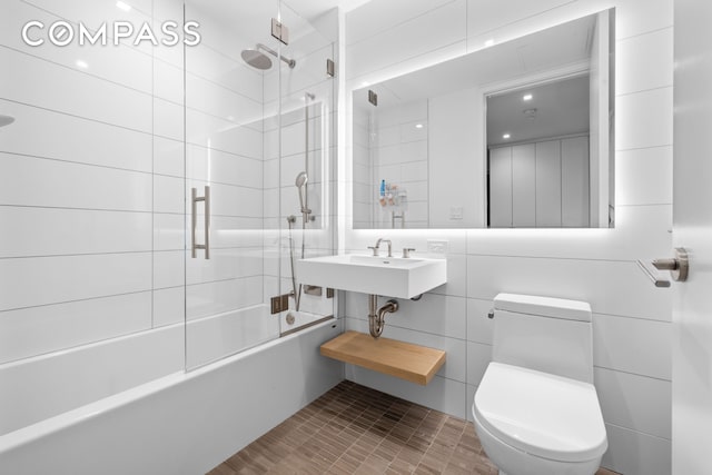 98 Front St Ph, Ph, New York City, NY 11201 - bathroom featuring a sink, tile walls, toilet, and shower / bath combination with glass door