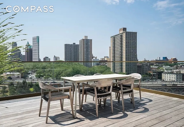 98 Front St Ph, Ph, New York City, NY 11201 - wooden terrace featuring a view of city and outdoor dining area