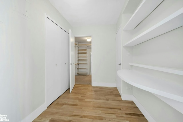 spacious closet featuring light wood-type flooring