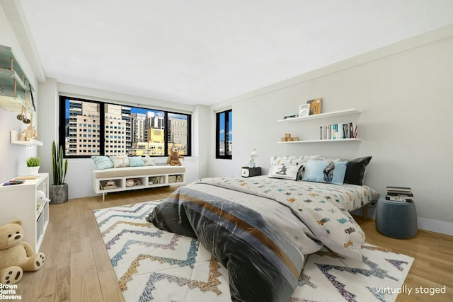 bedroom featuring wood finished floors
