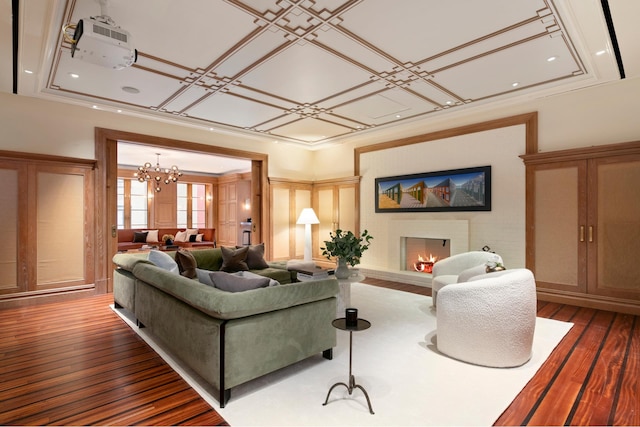 349 W 86th St, New York City, NY 10024 - living room with dark wood-type flooring, a chandelier, a brick fireplace, a decorative wall, and recessed lighting