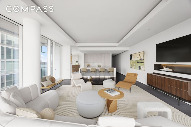 living room featuring a tray ceiling