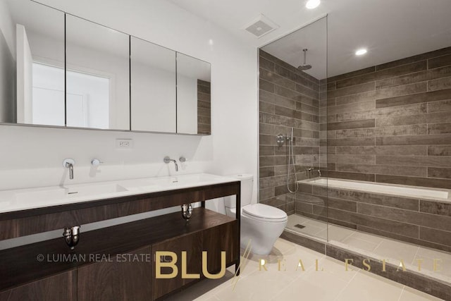 123 King St, New York City, NY 11231 - bathroom with toilet, double vanity, tiled shower, recessed lighting, and tile patterned floors