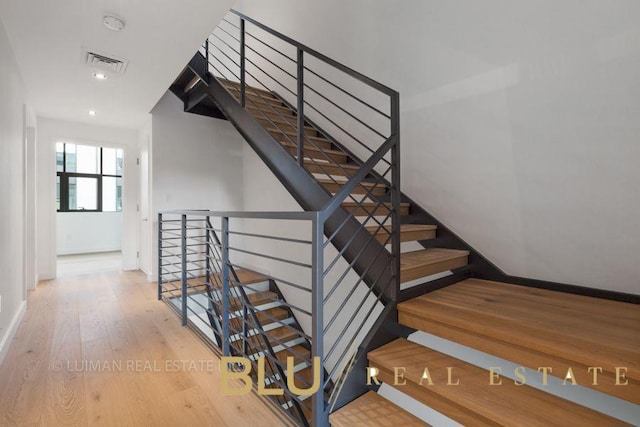 123 King St, New York City, NY 11231 - staircase with wood finished floors, baseboards, and recessed lighting