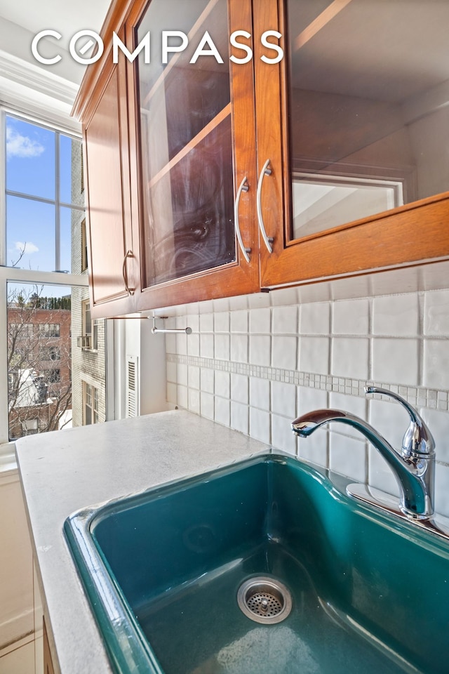 2 Horatio St Unit 8F, New York City, NY 10014 - kitchen view of backsplash, a sink, and light countertops